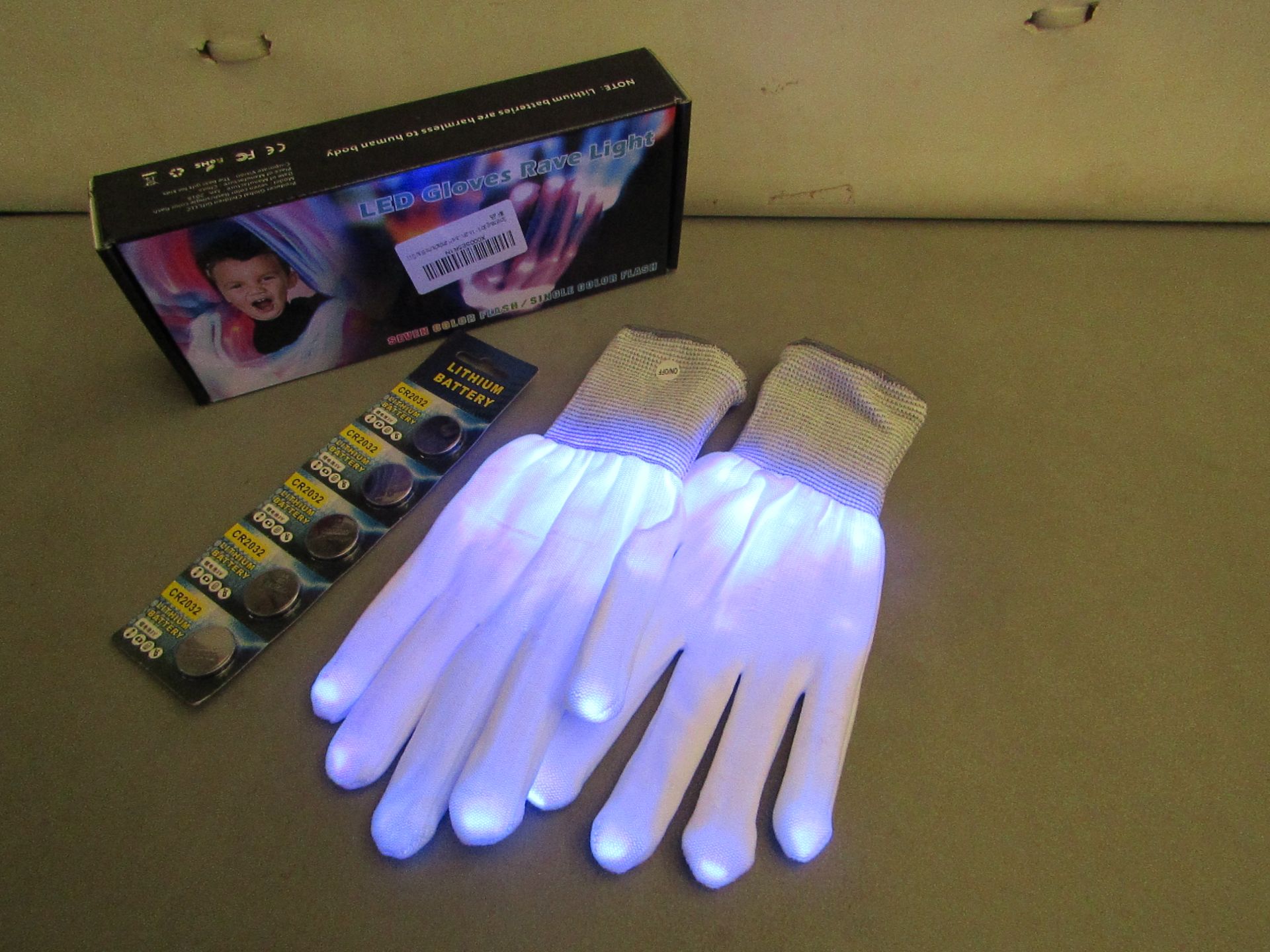 4 Pairs of LED Gloves Rave Light. Come with batteries plus Spare. Boxed. Ideal stocking fillers
