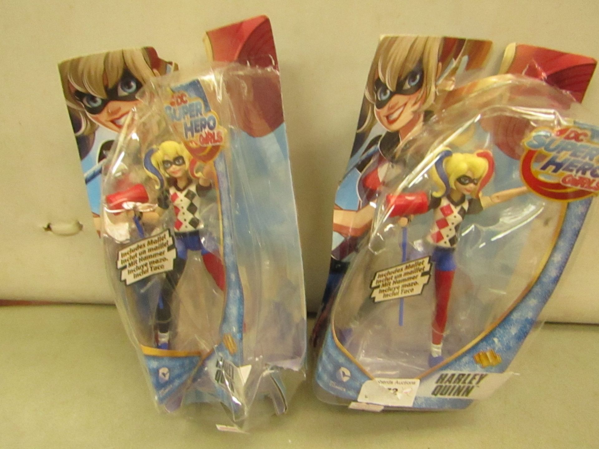 2 x Harley Quinn DC Super Hero Girls figuires. Packaging is damaged but items are fine