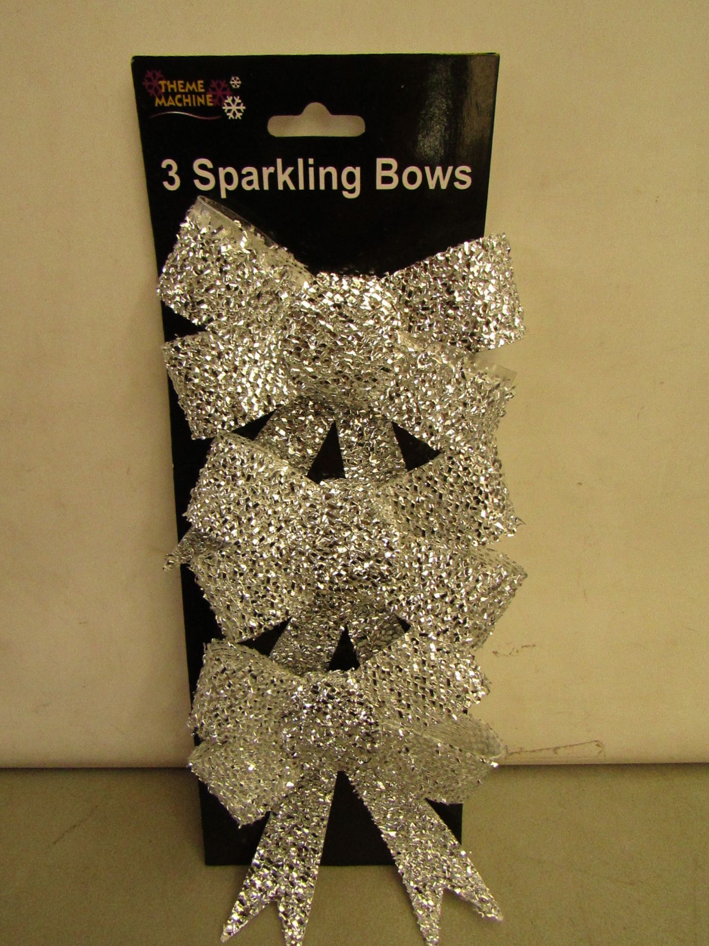 24 Packs of 3 Silver Sparkling Bows. Ideal for Xmas Trees. New & packaged