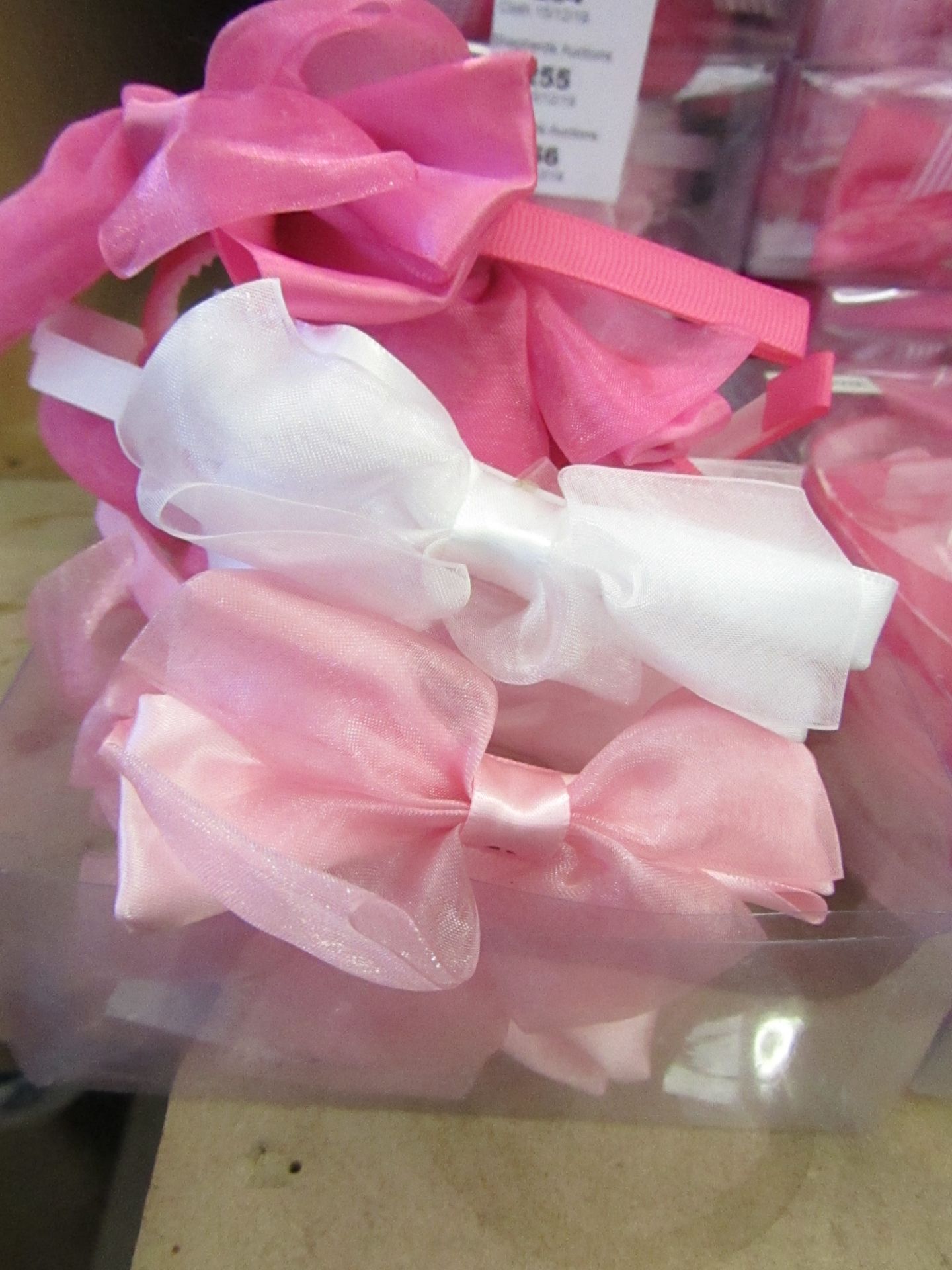 12 x various Coloured Bow Headbands similar product is RRP £3.50 each @ Claires Accessories