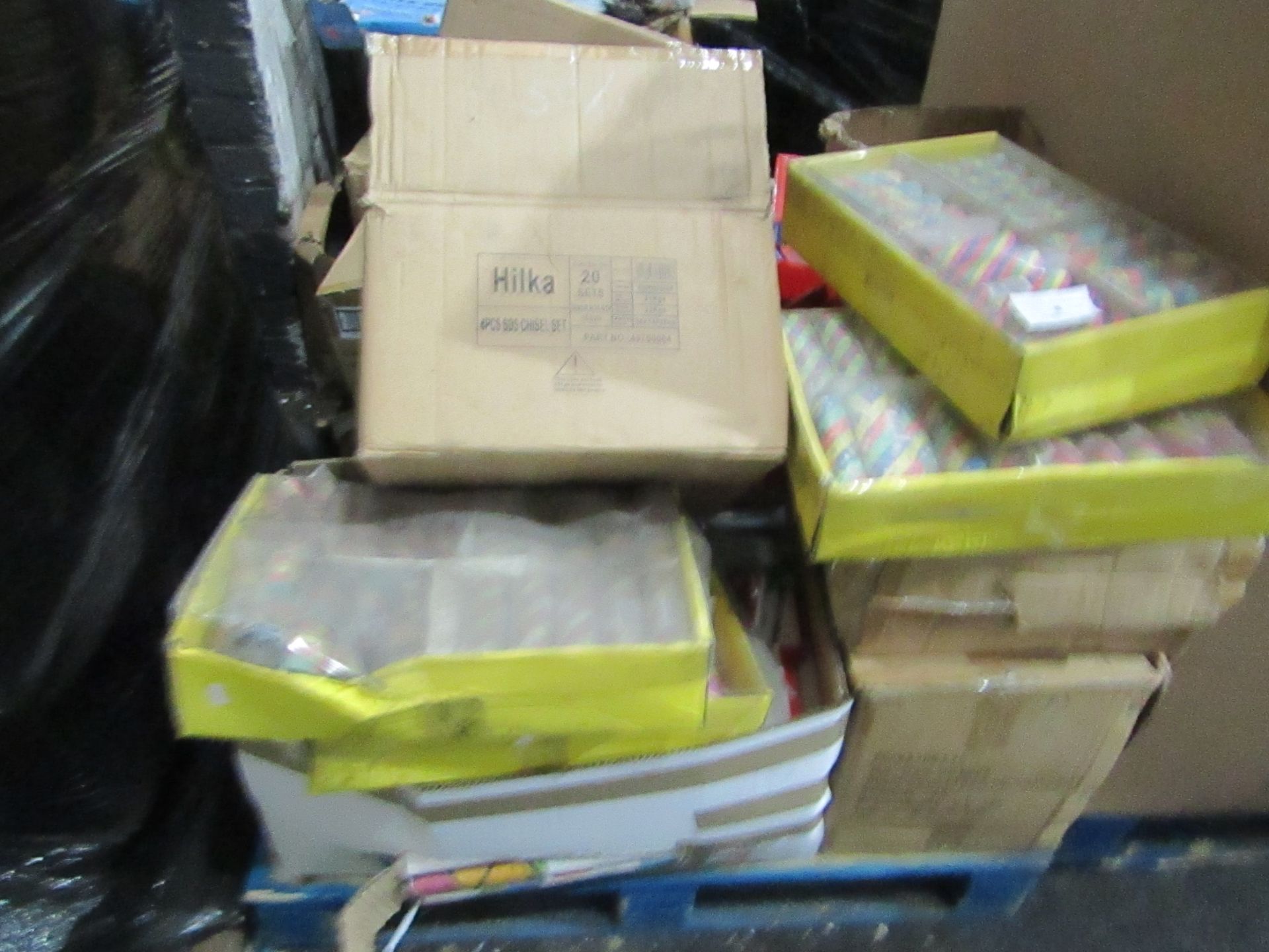 Pallet of Various Items which include telephone books, decorative paper, cast iron pan stands and