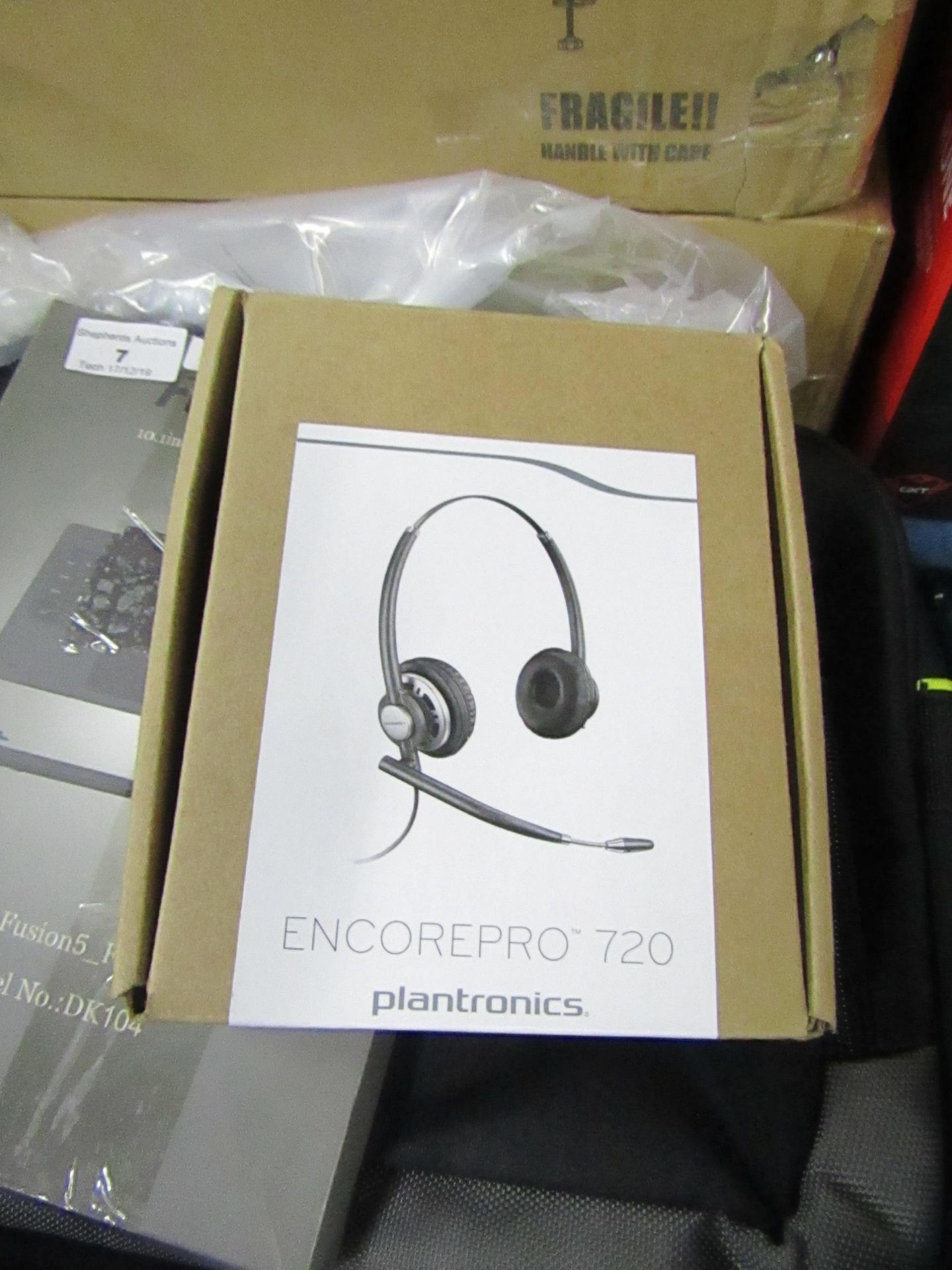 Plantronics office headset, untested and boxed.