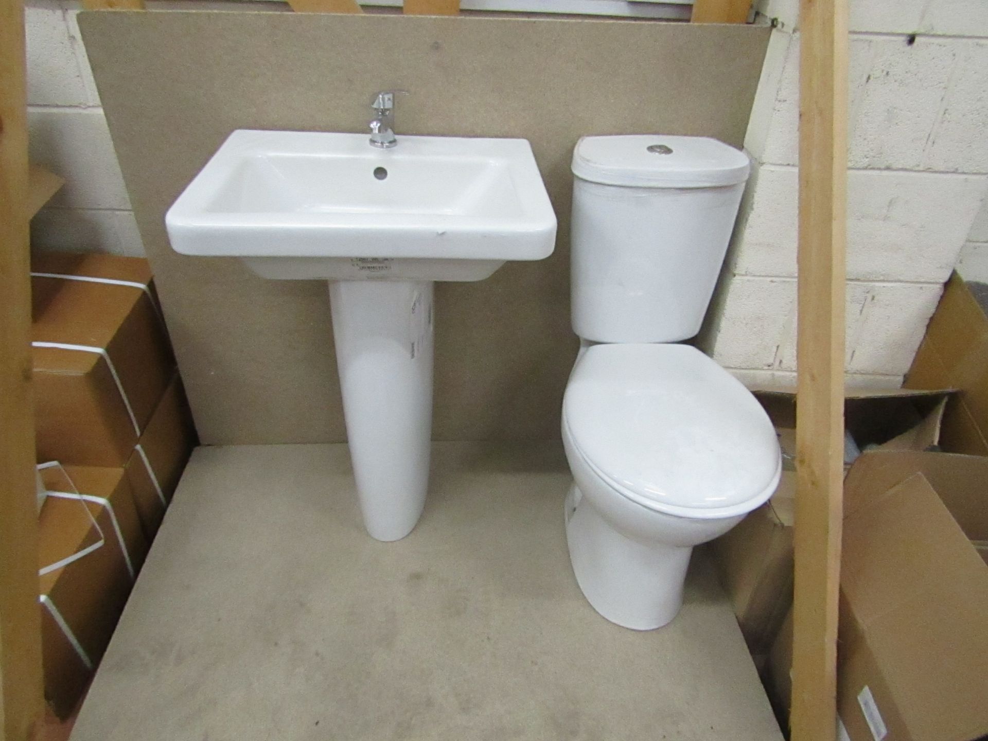 Complete Unbranded Roca toilet set that includes a complete close coupled toilet with flush and