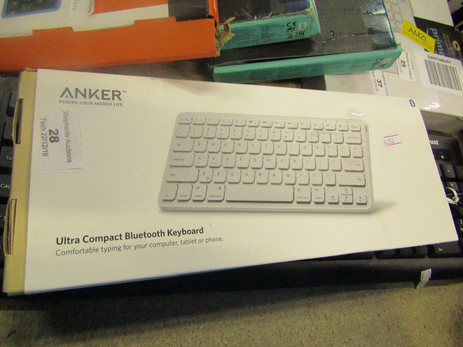 Anker ultra compact Bluetooth keyboard, untested and boxed.