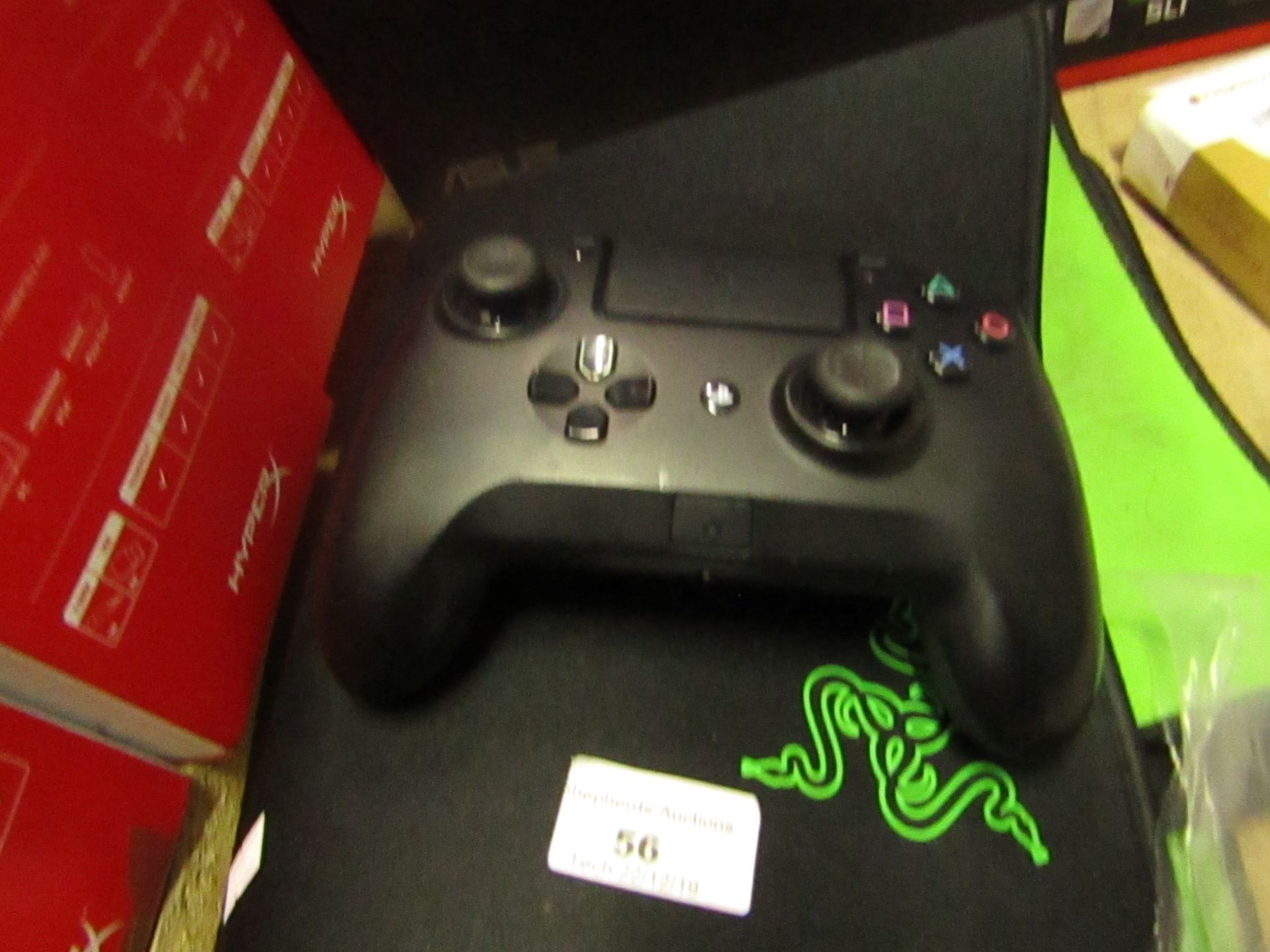 Razer Tournament Edition Pro PS4 controller, powers on but functions are not fully tested.