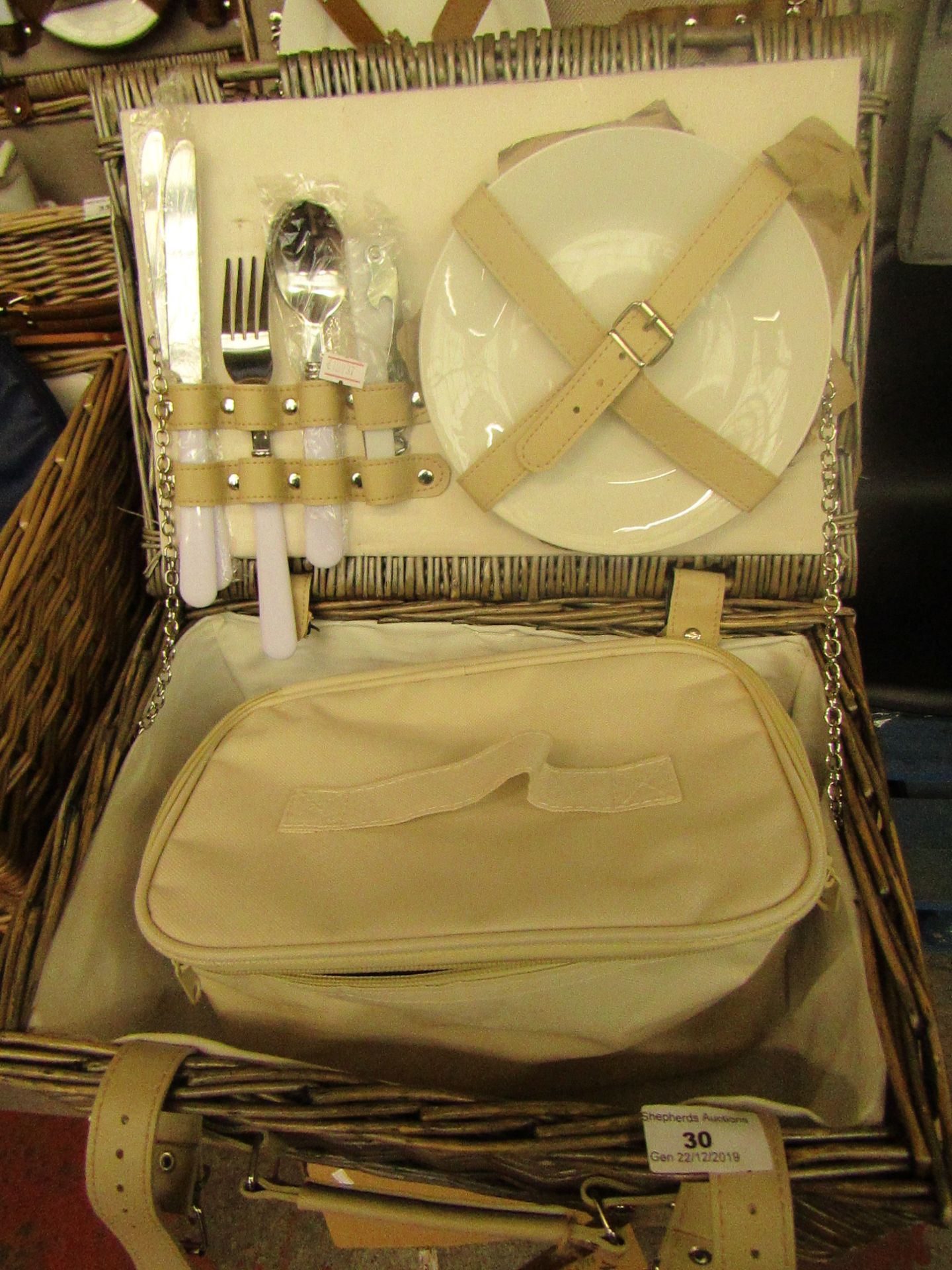 Picnic Basket - contains 2 small plates, 2 knifes, 2 spoons, 1 fork as one is missing, and a