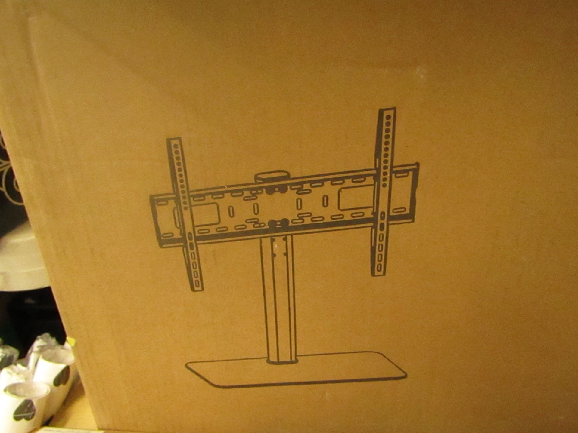 Freestanding TV bracket - unchecked and boxed.