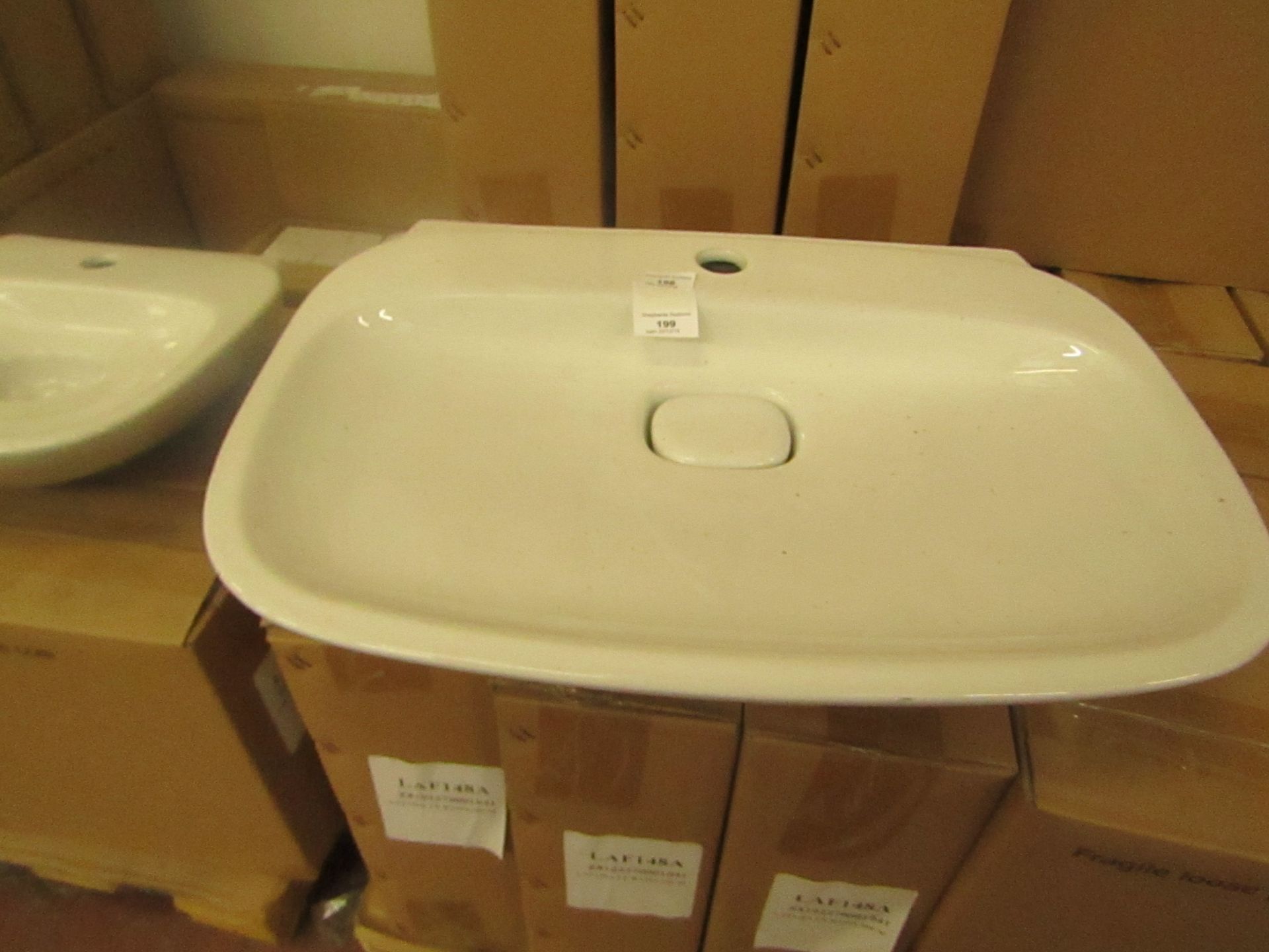 Laufen 600mm 1TH basin with waste trap ceramic cover, new and boxed.