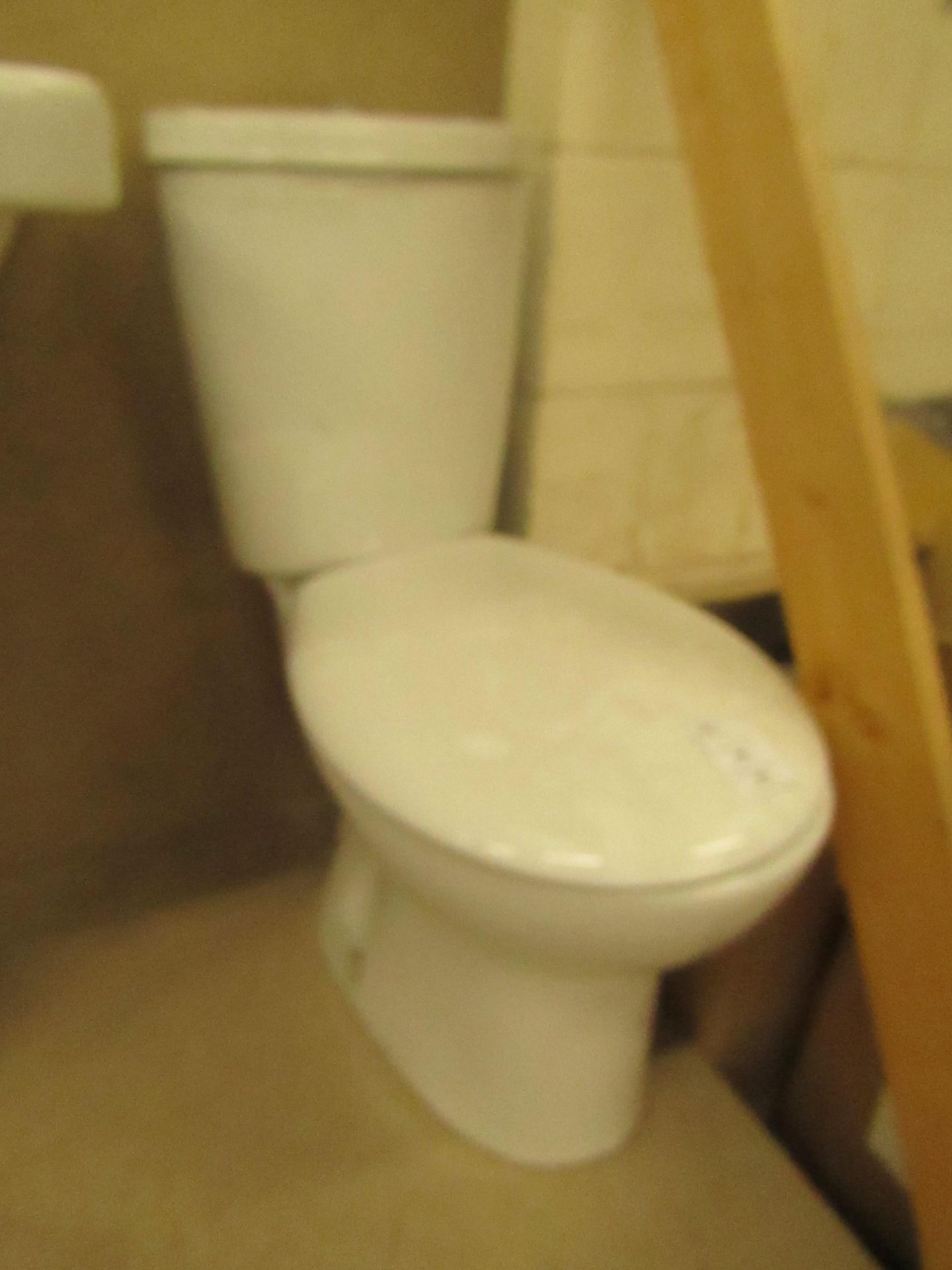 Complete Unbranded Roca toilet set that includes a complete close coupled toilet with flush and