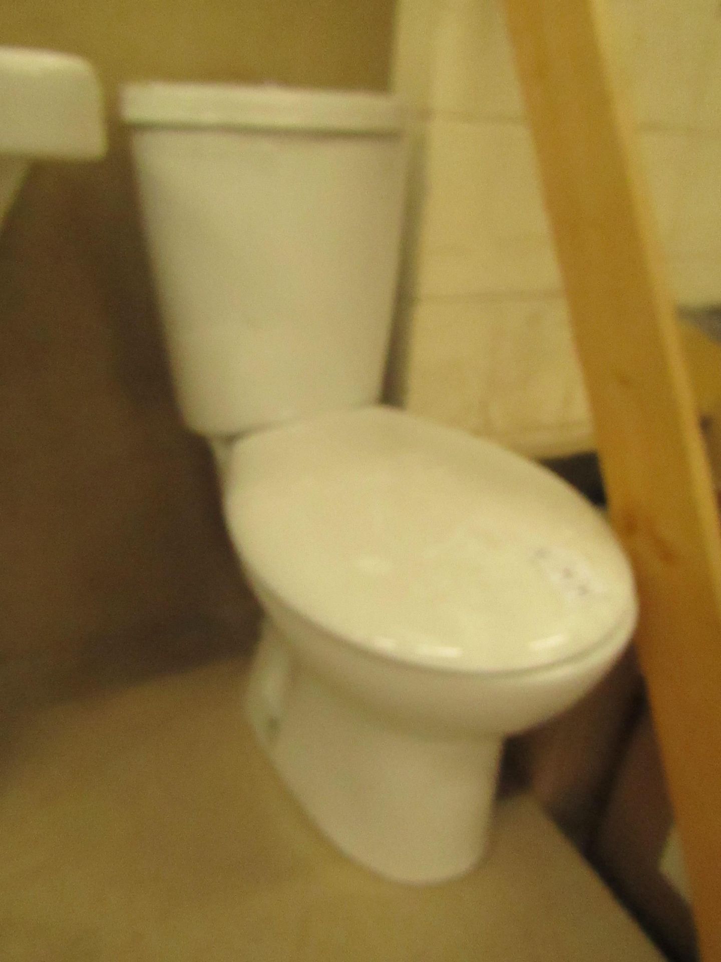 Complete Unbranded Roca toilet set that includes a complete close coupled toilet with flush and