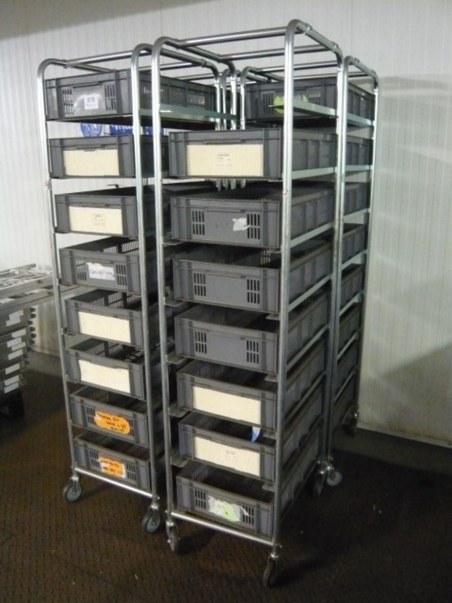 (4) Mobile trolleys with plastic tote bins as lotted