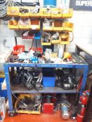 Mobile steel workbench including various motors and parts