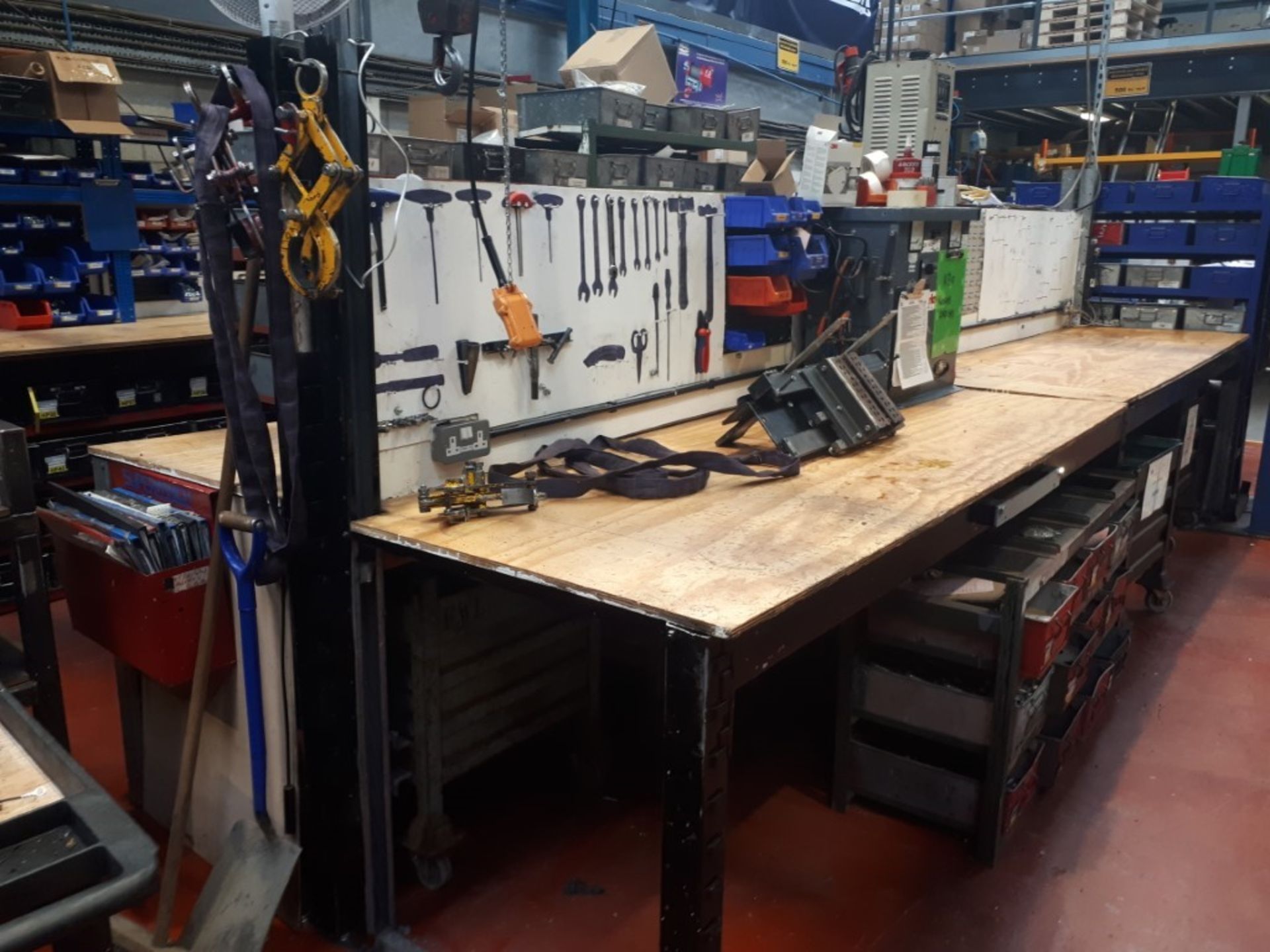 Bank of four steel framed workbenches with lin bins & assorted components