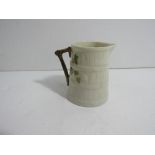 Royal Worcester bark-effect cream jug with a small bird design