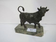 Bronze bull on marble base, height 19cms. Estimate £20-30.