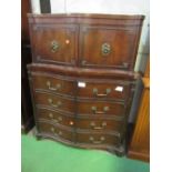 Mahogany serpentine fronted chest of 4 drawers with small linen press above. Heavy brass mounts.