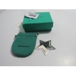 Tiffany & Co star shaped money clip pouch and Tiffany box. Estimate £15-25