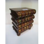 Small chest of 4 drawers in the form of a stack of books, 33cms high. Estimate £20-30.