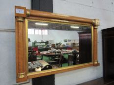 Maple veneer wall mirror, 106cms x 65cms. Estimate £10-20.