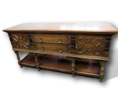 Oak sideboard by Waring & Gillow, with pot board & 2 centre drawers, flanked by 2 cupboards