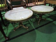 2 brass circular low tables with marble tops, 60cms diameter x 44cms high. Estimate £20-40.