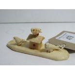 Faux ivory Ojimi of birds on birdhouse. Estimate £10-15.