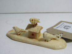 Faux ivory Ojimi of birds on birdhouse. Estimate £10-15.