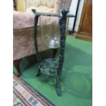 Glass jardinière on rose patterned metal stand. Estimate £5-10.