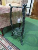 Glass jardinière on rose patterned metal stand. Estimate £5-10.