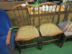 2 hardwood cane seat chairs. Estimate £10-20.