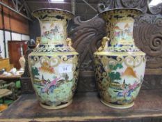Matched pair of very large Chinese enamelled scenic vases, 47cms tall. Estimate £40-60.