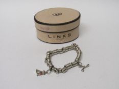 Links of London sterling silver Sweetie charm bracelet & charms. Estimate £28-40.