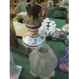 Edwardian ceramic oil lamp with frilled glass shade, converted to electricity. Estimate £10-20.