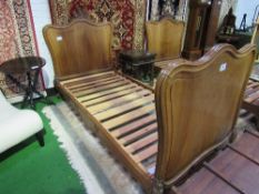 Pair of mahogany single bedsteads with carved head & footboards, 210cmx x 97cms. Estimate £80-120.