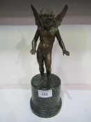 Bronze figurine of winged Putto on marble base, overall height 51cms. Estimate £20-40.