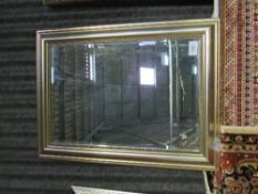 Gilt framed bevelled-edged wall mirror, 93cms x 68cms