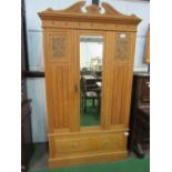 Pine wardrobe with drawer to base, centre mirror with carved detailing, 122cms x 219cms x 42cms.