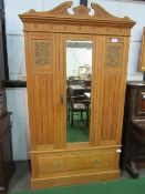 Pine wardrobe with drawer to base, centre mirror with carved detailing, 122cms x 219cms x 42cms.