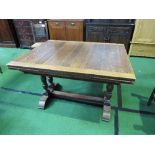 Oak extending dining table on stretcher base, 114cms x 77cms x 91cms. Estimate £10-20.