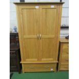 Hardwood double wardrobe with drawer below, 103cms x 191cms x 55cms. Estimate £50-80.