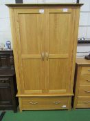 Hardwood double wardrobe with drawer below, 103cms x 191cms x 55cms. Estimate £50-80.