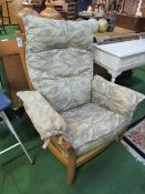 Ercol armchair c/w detachable cushions. Estimate £20-30.