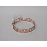 9ct rose gold bangle pierced with Greek key design. Hallmarked Chester in 1921 made by Henry