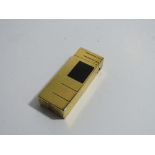 Gold plated & black enamel flip-top roller lighter, marked on base, Dunhill, Swiss made, code number