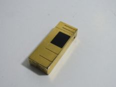 Gold plated & black enamel flip-top roller lighter, marked on base, Dunhill, Swiss made, code number