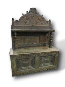 Large carved oak dresser with panelled back & shelf supported by 2 carved figures, 160cms x 64cms