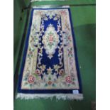 Pair of blue ground Chinese style rugs, 157cms x 77cms each