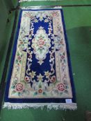 Pair of blue ground Chinese style rugs, 157cms x 77cms each