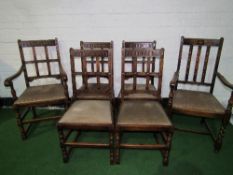 4 oak chairs & a carver with drop-in seats by Waring & Gillow & another carver. Estimate £100-120.