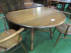 Ercol elm drop-side table, 123cms x 71cms. Estimate £40-60.